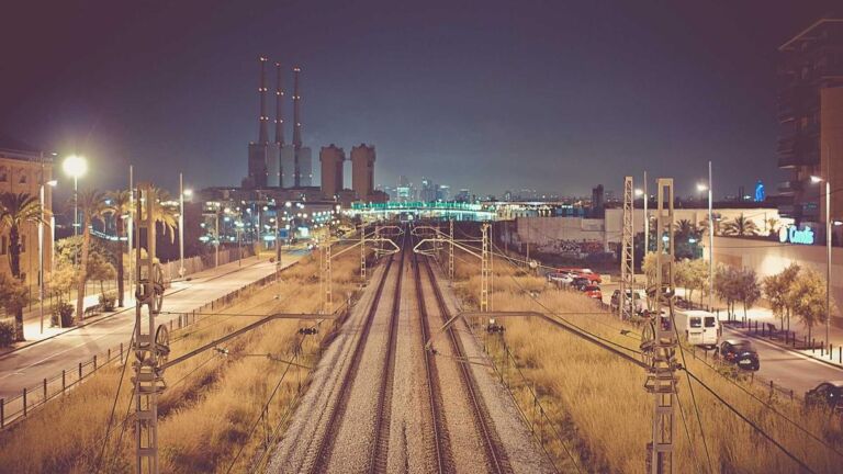 Railway tracks at night in a city